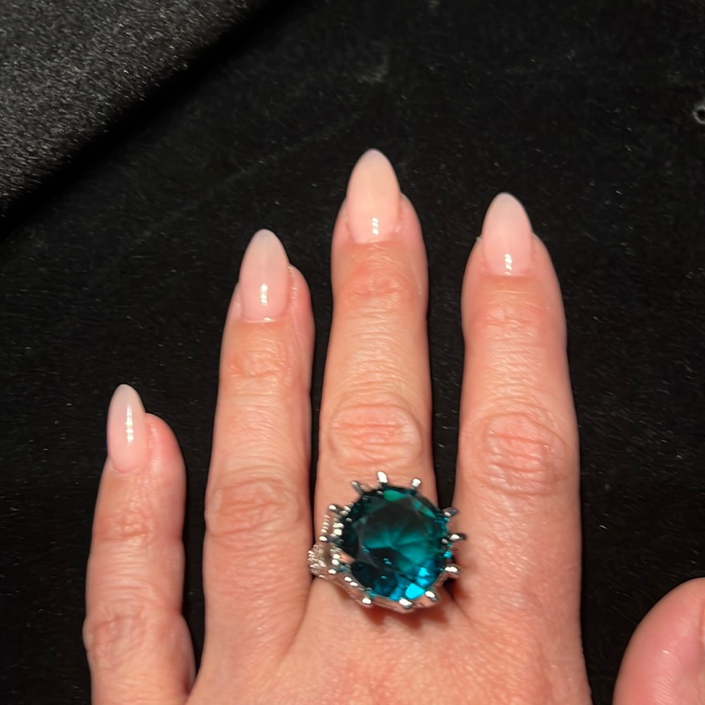 NEW FABULOUS BLUE COCKTAIL RING ENCRUSTED WITH CUBIC ZIRCONIA STONES.